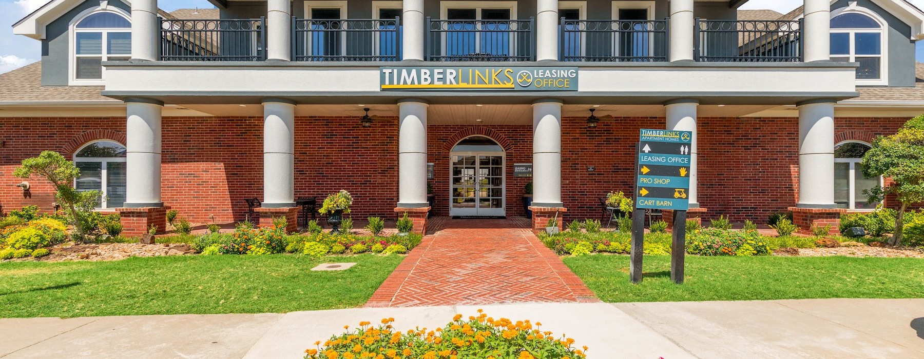 a building with columns and a sign in front of it