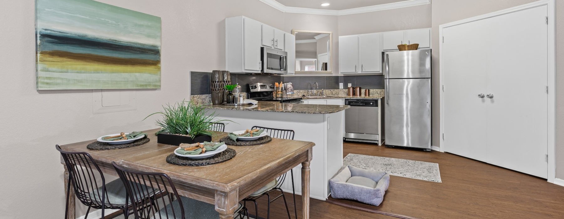 a kitchen with a dining table