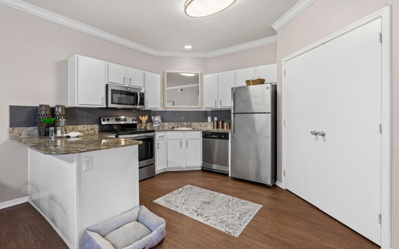 a kitchen with white cabinets